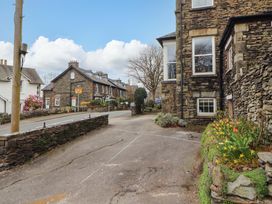 An outdoor view of a street and buildings at 1 Park Road in Windermere