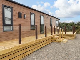 A building with a wooden deck and steps at Dolphin in Haverfordwest
