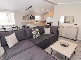 A living room with a sofa and table at Dolphin in Haverfordwest