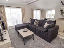 A living room with a sofa and coffee table at Dolphin in Haverfordwest