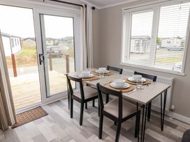 A dining room with a table set for meals at Dolphin in Haverfordwest