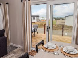 A dining area with a table set for meal at Dolphin in Haverfordwest
