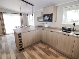 A kitchen with sink and microwave at Dolphin in Haverfordwest