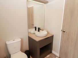 A bathroom with a toilet and sink at Dolphin in Haverfordwest