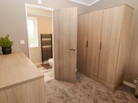 A bathroom with a wardrobe and toilet at Dolphin in Haverfordwest