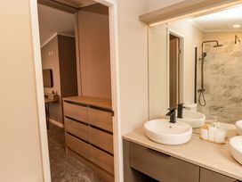 A bathroom with a sink and shower at Dolphin in Haverfordwest