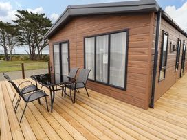 An outdoor area with a table and chairs at Dolphin in Haverfordwest