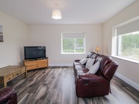A living room with a sofa and television at teac Caoimhe Falcarragh