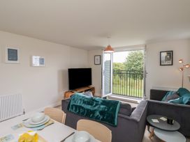 A living room with a sofa and a television at Larpool Retreat