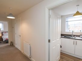 A kitchen area with a sink and window at Larpool Retreat