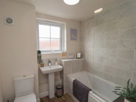 A bathroom with a sink and bathtub at Larpool Retreat