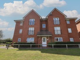 A multi-story brick building with balconies at Larpool Retreat 