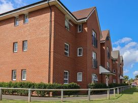 A brick building with windows and balconies at Larpool Retreat