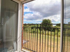 A balcony view with grass and trees at Larpool Retreat in Whitby