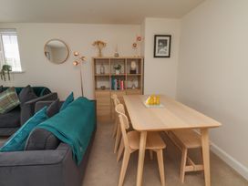 A dining room with a table and chairs at Larpool Retreat in Whitby