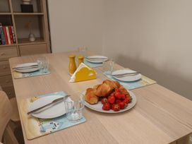 A dining table set with plates and food at Larpool Retreat in Whitby