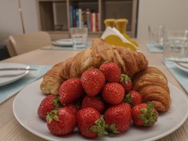 A plate with strawberries and croissants at Larpool Retreat in Whitby