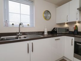 A kitchen with a sink and microwave at Larpool Retreat in Whitby