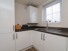 A kitchen with a sink and toaster at Larpool Retreat in Whitby