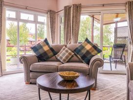 A living room with a sofa and coffee table at Badgers Retreat - Two Dales in Richmond