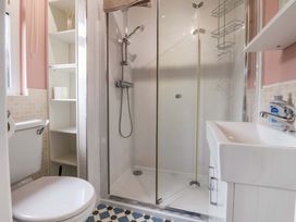 A bathroom with a shower and sink at Badgers Retreat - Two Dales, Richmond