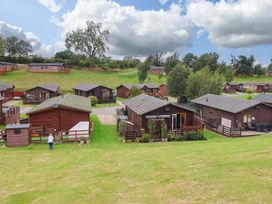 An outdoor area with cabins and grass at Badgers Retreat - Two Dales in Richmond
