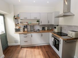 A kitchen with countertops and appliances at Vern Dale in Builth Wells