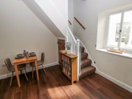 A dining area with a table and chairs at Vern Dale in Builth Wells