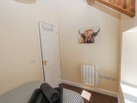 A bedroom with a bed and a painting at Vern Dale in Builth Wells