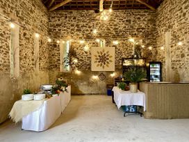 An event space with tables and decorations at West Cottage Myddfai near Llandovery