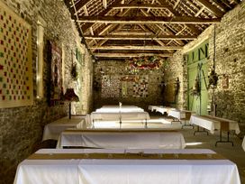 A dining hall with tables and decorations at West Cottage Myddfai near Llandovery