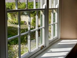 A window with a view of a garden at West Cottage in Myddfai near Llandovery