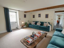 A living room with a sofa and coffee table at West Cottage in Myddfai near Llandovery