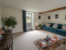 A living room with a sofa and coffee table at West Cottage in Myddfai near Llandovery