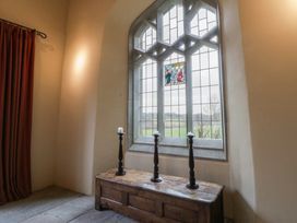 An interior view with a window and candles at Gatekeepers Cottage Myddfai near Llandovery