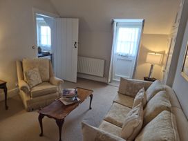 A living room with sofa and armchair at Gatekeepers Cottage Myddfai near Llandovery