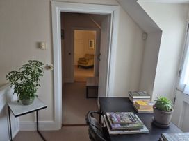 A study with a table, books and a plant at Gatekeepers Cottage in Myddfai near Llandovery