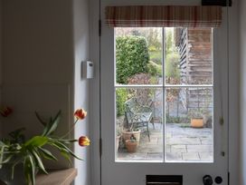 A kitchen with a view of a garden from a door at Gatekeepers Cottage Myddfai near Llandovery