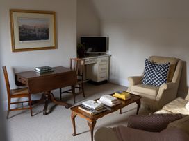 A living room with a table and chairs at Gatekeepers Cottage in Myddfai near Llandovery