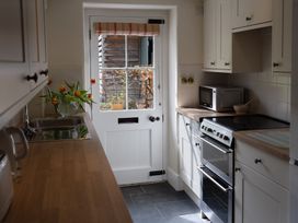 A kitchen with a sink and oven at Gatekeepers Cottage in Myddfai near Llandovery