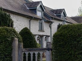 House with windows and door surrounded by hedges at Gatekeepers Cottage Myddfai near Llandovery