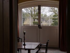 A dining room with a table and chairs at Gatekeepers Cottage Myddfai near Llandovery