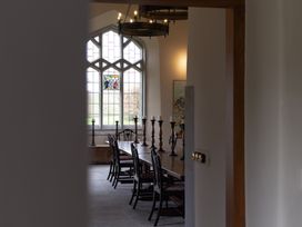 A dining room with a table and chairs at Gatekeepers Cottage Myddfai near Llandovery