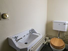 A bathroom with a sink and a toilet at North Cottage in Llandovery