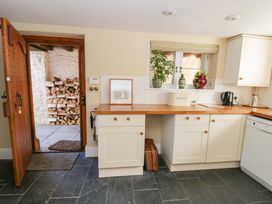 A kitchen with a wooden countertop and appliances at North Cottage Myddfai near Llandovery
