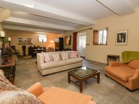 A living room with furniture including a sofa and coffee table at North Cottage Myddfai near Llandovery