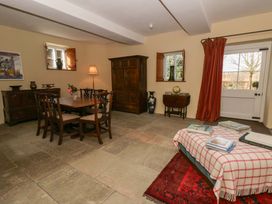 A dining room with a table and chairs at North Cottage Myddfai near Llandovery