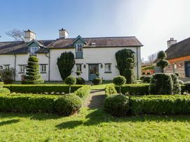 A cottage with a garden and topiary at North Cottage Myddfai near Llandovery