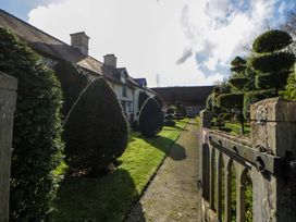 A garden with neatly trimmed hedges at North Cottage in Myddfai near Llandovery