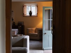 A living room with a sofa and a table at North Cottage Myddfai near Llandovery